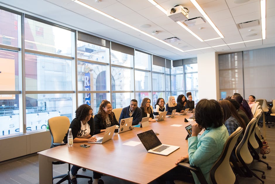 A diverse team of business professionals collaborating in a modern meeting room